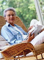 Woman sitting in chair with book